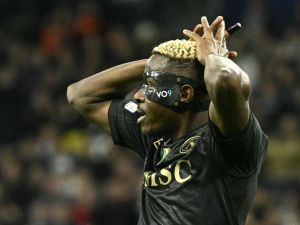 Napoli's Nigerian forward #09 Victor Osimhen reacts during the UEFA Champions League first round group C football match between Real Madrid CF and SSC Naples at the Santiago Bernabeu stadium in Madrid on November 29, 2023. (Photo by JAVIER SORIANO / AFP)