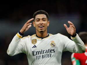 Real Madrid's English midfielder #5 Jude Bellingham reacts during the Spanish league football match between Real Madrid CF and Granada FC at the Santiago Bernabeu stadium in Madrid on December 1, 2023. (Photo by OSCAR DEL POZO / AFP)