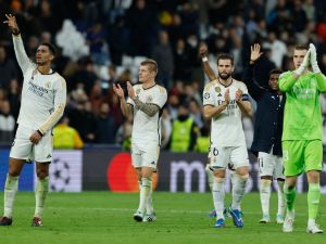 Real Madrid players celebrate at the end of the UEFA Champions League first round group C football match between Real Madrid CF and SSC Naples at the Santiago Bernabeu stadium in Madrid on November 29, 2023. (Photo by OSCAR DEL POZO / AFP)