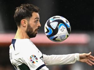 Portugal’s midfielder #10 Bernardo Silva chest controls the ball during the UEFA Euro 2024 Group J qualification football match between Liechtenstein and Portugal at the Rheinpark stadium in Vaduz, Liechtenstein, on November 16, 2023. (Photo by SEBASTIEN BOZON / AFP)