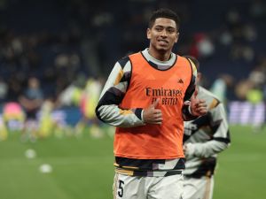 Real Madrid's English midfielder #5 Jude Bellingham warms up prior to the Spanish league football match between Real Madrid CF and Villarreal CF at the Santiago Bernabeu stadium in Madrid on December 17, 2023. (Photo by Thomas COEX / AFP)