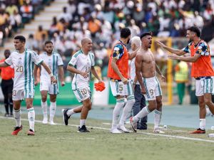 Algeria's forward #9 Baghdad Bounedjah (2R) celebrates with teammates after scoring his team's second goal during the Africa Cup of Nations (CAN) 2024 group D football match between Algeria and Burkina Faso at Stade de la Paix in Bouake on January 20, 2024. (Photo by KENZO TRIBOUILLARD / AFP)