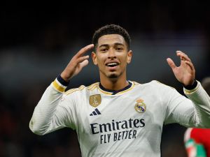 Real Madrid's English midfielder #5 Jude Bellingham reacts during the Spanish league football match between Real Madrid CF and Granada FC at the Santiago Bernabeu stadium in Madrid on December 1, 2023. (Photo by OSCAR DEL POZO / AFP)