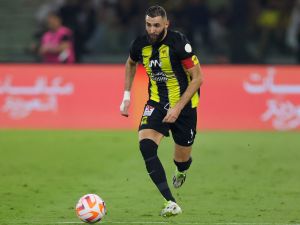 Ittihad's French forward #09 Karim Benzema runs with the ball during the Saudi Pro League football match between Al-Ittihad and Al-Nassr at King Abdullah Sports City Stadium in Jeddah on December 26, 2023. (Photo by AFP)