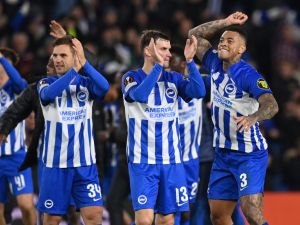 Brighton's players celebrate on the pitch after the UEFA Europa League Group B football match between Brighton and Hove Albion and Marseille at the American Express Community Stadium in Brighton, southern England on December 14, 2023. Brighton won the game 1-0 and top the Group. (Photo by Glyn KIRK / AFP)