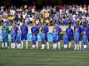 Chelsea players stand for their national anthem ahead of a pre-season friendly football match between Chelsea FC and Borussia Dortmund BVB at Soldier Field in Chicago, Illinois, on August 2, 2023. (Photo by KAMIL KRZACZYNSKI / AFP)
