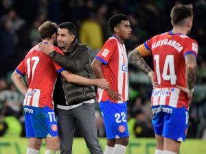 Girona's Spanish coach Michel greets Girona's Dutch defender #17 Daley Blind at the end of the Spanish league football match between Real Betis and Girona FC at the Benito Villamarin stadium in Seville on December 21, 2023. (Photo by CRISTINA QUICLER / AFP)