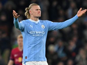 Manchester City's Norwegian striker #09 Erling Haaland rallies the crowd after scoring the team's first goal during the UEFA Champions League Group G football match between Manchester City and RG Leipzig at the Etihad Stadium, in Manchester, north west England, on November 28, 2023. (Photo by Paul ELLIS / AFP)