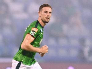 Ettifaq's English midfielder #10 Jordan Henderson runs past Nassr's Senegalese Forward #10 Sadio Mane during the Saudi Pro League football match between Al-Ettifaq and Al-Nassr at the Prince Mohamed bin Fahd Stadium in Dammam on August 14, 2023. (Photo by Ali Alhaji / AFP)