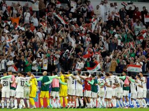 Iraq's players greet their fans at the end of the Qatar 2023 AFC Asian Cup Group D football match between Indonesia and Iraq at the Ahmad bin Ali Stadium in Al-Rayyan, west of Doha on January 15, 2024. (Photo by KARIM JAAFAR / AFP)