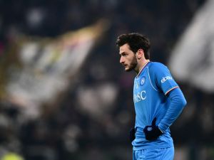 Napoli's Georgian forward #77 Khvicha Kvaratskhelia looks on during the Italian Serie A football match between Juventus and Napoli, at The Allianz Stadium, in Turin on December 8, 2023. (Photo by Marco BERTORELLO / AFP)