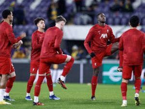 Liverpool FC's players participate in the warming session prior to the start of the UEFA Europa League football match between Union Saint Gilloise and Liverpool FC at the Lotto Park in Brussels on December 14, 2023. (Photo by KENZO TRIBOUILLARD / AFP)