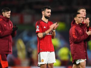 Manchester United's Portuguese midfielder #08 Bruno Fernandes reacts after the UEFA Champions League group A football match between Manchester United and FC Bayern Munich at Old Trafford stadium in Manchester, north west England, on December 12, 2023. (Photo by PETER POWELL / AFP)