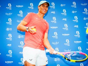Spain's Rafael Nadal hits balls to fans during a promotional event ahead of the Brisbane International tennis tournament in Brisbane on December 29, 2023. (Photo by Patrick HAMILTON / AFP)