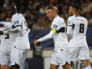 Paris Saint-Germain's French forward #07 Kylian Mbappe (C) celebrates with teammates after scoring his team's fourth goal during the French Cup football match between US Revel and Paris Saint-Germain at the Pierre-Fabre stadium in Castres, southern France, on January 7, 2024. (Photo by Valentine CHAPUIS / AFP)