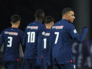Paris Saint-Germain's French forward #07 Kylian Mbappe (R) reacts after scoring his team's second goal during the French Cup round of 32 football match between US Orleans Loiret Football and Paris Saint-Germain (PSG) at the Stade de la Source, in Orleans, central France, on January 20, 2024. (Photo by Guillaume SOUVANT / AFP)