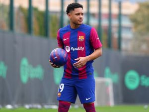 Brazilian forward Vitor Roque holds a ball during his official presentation as new player of FC Barcelona at the Joan Gamper training ground in Sant Joan Despi, near Barcelona, on January 5, 2024. (Photo by Pau BARRENA / AFP)