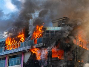 Burning building in thick smoke
