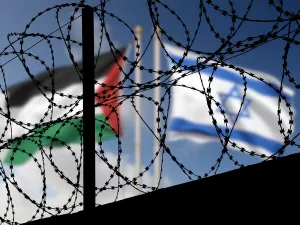 Flags of Israel and Palestine and barbed wire