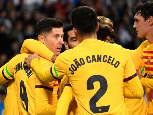 Barcelona's Polish forward #09 Robert Lewandowski celebrates scoring the opening goal during the Spanish league football match between Deportivo Alaves and FC Barcelona at the Mendizorroza stadium in Vitoria on February 3, 2024. (Photo by Ander Gillenea / AFP)