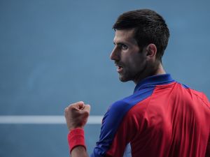 Serbia's Novak Djokovic celebrates a point against Spain's Pablo Carreno Busta during their Tokyo 2020 Olympic Games men's singles tennis match for the bronze medal at the Ariake Tennis Park in Tokyo on July 31, 2021. (Photo by Tiziana FABI / AFP)