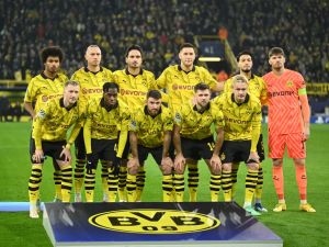 BVB Borussia Dortmund's players line up prior to the start of the UEFA Champions League group F football match between BVB Borussia Dortmund and Paris Saint-Germain in Dortmund, western Germany, on December 13, 2023. (Photo by INA FASSBENDER / AFP)