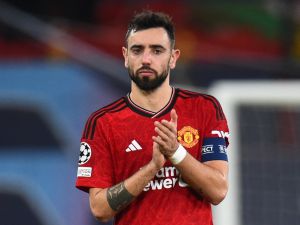 Manchester United's Portuguese midfielder #08 Bruno Fernandes reacts after the UEFA Champions League group A football match between Manchester United and FC Bayern Munich at Old Trafford stadium in Manchester, north west England, on December 12, 2023. (Photo by PETER POWELL / AFP)