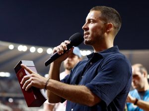 Former Red Devils captain Eden Hazard speaks as he celebrates the end of his career with the Belgian national team Red Devils, during a ceremony after the UEFA Euro 2024 group F qualification football match between Belgium and Austria at the King Baudouin Stadium in Brussels, on June 17, 2023. (Photo by Kenzo TRIBOUILLARD / AFP)