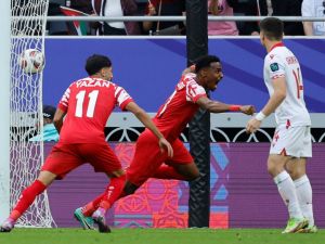 Jordan's defender #03 Abdallah Nasib celebrates scoring his team's first goal during the Qatar 2023 AFC Asian Cup quarter-final football match between Tajikistan and Jordan at the Ahmad Bin Ali Stadium in Al-Rayyan, west of Doha on February 2, 2024. (Photo by KARIM JAAFAR / AFP)