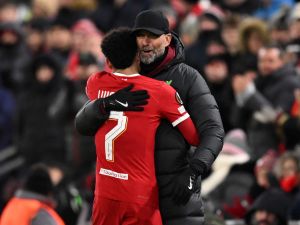 Liverpool's German manager Jurgen Klopp embraces Liverpool's Colombian midfielder #07 Luis Diaz as he leaves the game, substituted during the UEFA Europa League group E football match between Liverpool and Linzer ASK at Anfield in Liverpool, north west England on November 30, 2023. (Photo by Oli SCARFF / AFP)