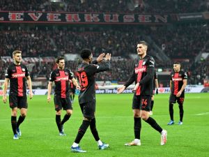 Bayer Leverkusen's Czech forward #14 Patrik Schick (2nd R) and Bayer Leverkusen's English midfielder #19 Nathan Tella (C) celebrate after Molde scored a 3-0 own goal during the UEFA Europa League Group H football match between Bayer 04 Leverkusen and Molde FK in Leverkusen, on December 14, 2023. (Photo by ULRICH HUFNAGEL / AFP)