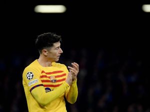 Barcelona's Polish forward #09 Robert Lewandowski celebrates after scoring a goal during the UEFA Champions League round of 16 first Leg football match between Napoli and Barcelona at the Diego-Armando-Maradona stadium in Naples on February 21, 2024. (Photo by Filippo MONTEFORTE / AFP)
