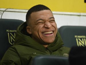 Paris Saint-Germain's French forward #07 Kylian Mbappe smiles prior to the French L1 football match between FC Nantes and Paris Saint-Germain (PSG) at the La Beaujoire stadium in Nantes, western France, on February 17, 2024. (Photo by Sebastien SALOM-GOMIS / AFP)