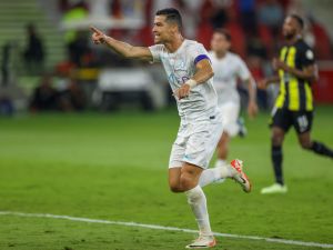 Nassr's Portuguese forward #07 Cristiano Ronaldo celebrates his second goal during the Saudi Pro League football match between Al-Ittihad and Al-Nassr at King Abdullah Sports City Stadium in Jeddah on December 26, 2023. (Photo by AFP)