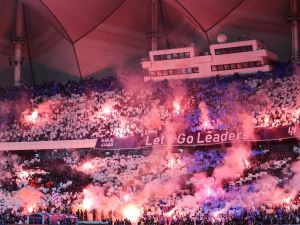 Supporters cheer in the stands during the Saudi Pro League football match between Al-Hilal and Al-Nassr at the King Fahd International Stadium in Riyadh on December 1, 2023. (Photo by Fayez NURELDINE / AFP)