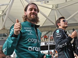 Aston Martin's German driver Sebastian Vettel (L) gives the thumbs-up as he arrives for an end-of-season drivers group picture ahead of the Abu Dhabi Formula One Grand Prix at the Yas Marina Circuit in the Emirati city of Abu Dhabi on November 20, 2022. (Photo by Ben Stansall / AFP)