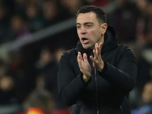 Barcelona's Spanish coach Xavi claps during the Spanish league football match between FC Barcelona and CA Osasuna at the Estadi Olimpic Lluis Companys in Barcelona on January 31, 2024. (Photo by LLUIS GENE / AFP)