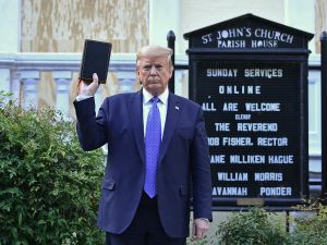 Donald Trump is selling $59.99 bibles with ‘God Bless the U.S.A.’ singer Lee Greenwood. (Brendan Smialowski/ AFP)