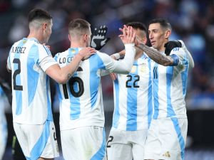 Argentina's midfielder #16 Giovani Lo Celso (2nd L) celebrates with teammates after scoring a goal during the international friendly football match between El Salvador and Argentina at Lincoln Financial Field in Philadelphia, Pennsylvania, on March 22, 2024. (Photo by Charly TRIBALLEAU / AFP)