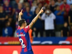 Barcelona's Portuguese defender #02 Joao Cancelo celebrates after scoring his team's third goal during the Spanish Liga football match between FC Barcelona and RC Celta de Vigo at the at the Estadi Olimpic Lluis Companys in Barcelona on September 23, 2023. (Photo by Pau BARRENA / AFP)