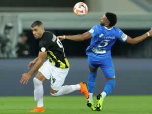 Hilal's Saudi defender #05 Ali al-Bulaihi and Ittihad's Moroccan forward #99 Abderrazak Hamdallah vie for the ball during the Saudi Pro League football match between Al-Ittihad and Al-Hilal at Prince Abdullah al-Faisal Stadium in Jeddah on September 1, 2023. (Photo by AFP)