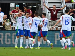 Italy's forward #09 Mateo Retegui (L) celebrates scoring his team's first goal with teammates during the international friendly football match between Venezuela and Italy at Chase Stadium in Fort Lauderdale, Florida, March 21, 2024. (Photo by CHANDAN KHANNA / AFP)