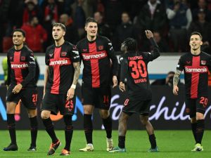 Bayer Leverkusen's Czech forward #14 Patrik Schick (C) celebrates scoring the 3-2 goal with team mates during the UEFA Europa League Group round of 16, second-leg football match between Bayer 04 Leverkusen and Garabagh in Leverkusen, western Germany on March 14, 2024. (Photo by INA FASSBENDER / AFP)