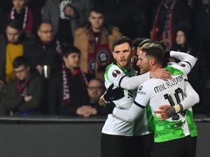 Liverpool's Uruguayan striker #09 Darwin Nunez (hidden) celebrates after scoring a goal with team mates during the UEFA Europa League round of 16 first leg football match between AC Sparta Praha and Liverpool FC in Prague on March 7, 2024. (Photo by MICHAL CIZEK / AFP)