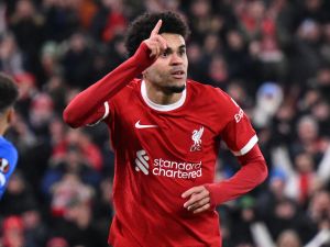 Liverpool's Colombian midfielder #07 Luis Diaz celebrates after scoring the opening goal of the UEFA Europa League group E football match between Liverpool and Linzer ASK at Anfield in Liverpool, north west England on November 30, 2023. (Photo by Oli SCARFF / AFP)