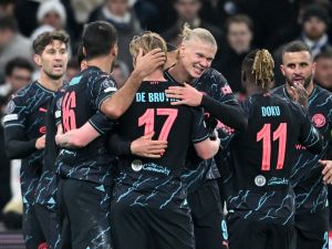 Manchester City's players celebrate during the UEFA Champions League round of 16, first-leg football match between FC Copenhagen and Manchester City in Copenhagen, Denmark, on February 13, 2024. (Photo by Jonathan NACKSTRAND / AFP)