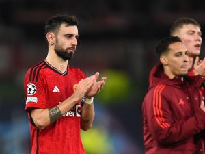 Manchester United's Portuguese midfielder #08 Bruno Fernandes reacts after the UEFA Champions League group A football match between Manchester United and FC Bayern Munich at Old Trafford stadium in Manchester, north west England, on December 12, 2023. (Photo by PETER POWELL / AFP)