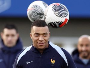 France's forward Kylian Mbappe looks on during a training session as part of the team's preparation for upcoming friendly football matches, in Clairefontaine-en-Yvelines on March 19, 2024. (Photo by FRANCK FIFE / AFP)