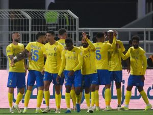 Nassr's players celebrate their team's third goal during the Saudi Pro League football match between Al-Shabab and Al-Nassr at the Al-Shabab Club Stadium in Riyadh on February 25, 2024. (Photo by Fayez NURELDINE / AFP)