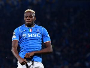 Napoli's Nigerian forward #09 Victor Osimhen celebrates after scoring a goal during the UEFA Champions League round of 16 first Leg football match between Napoli and Barcelona at the Diego-Armando-Maradona stadium in Naples on February 21, 2024. (Photo by Tiziana FABI / AFP)